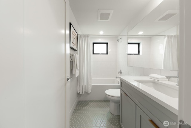 bathroom with toilet, shower / bath combo with shower curtain, visible vents, and tile patterned floors