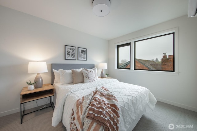 carpeted bedroom featuring baseboards