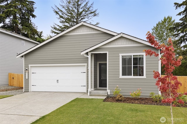 ranch-style home featuring a garage, driveway, a front yard, and fence