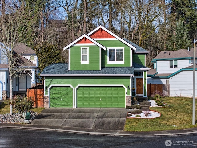 view of front of property with a garage, a shingled roof, fence, driveway, and a front yard