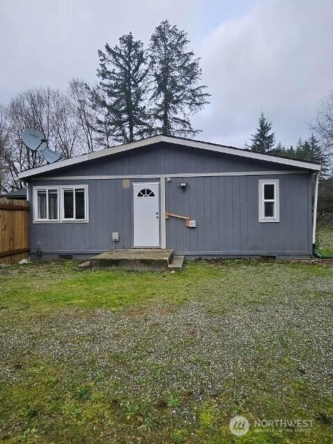 view of outbuilding with fence