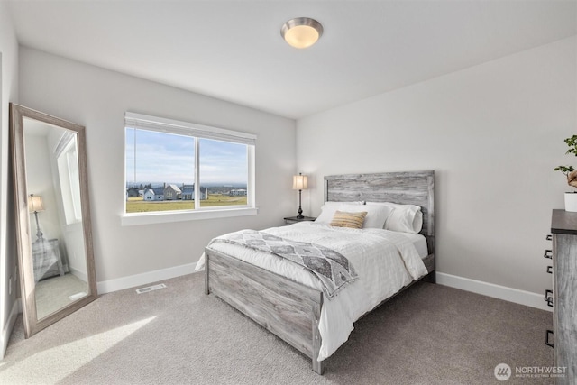 bedroom with visible vents, baseboards, and carpet flooring