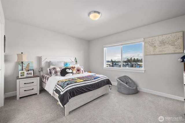 bedroom featuring baseboards and carpet flooring