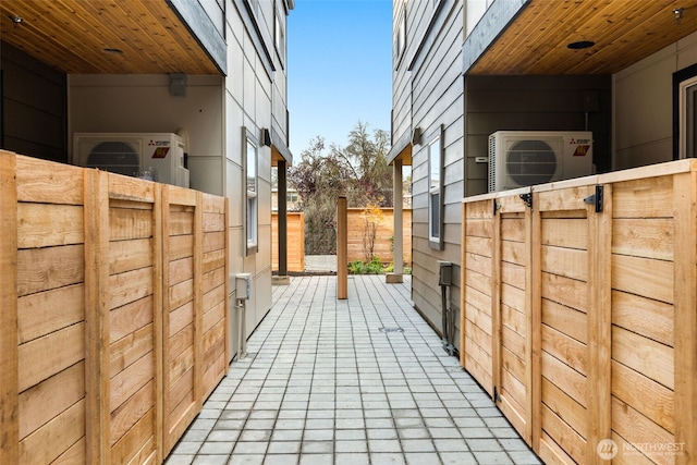 exterior space featuring ac unit and fence