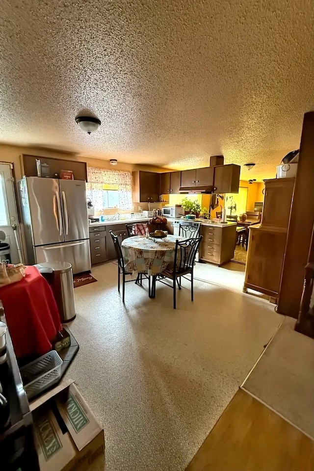 dining room featuring a textured ceiling