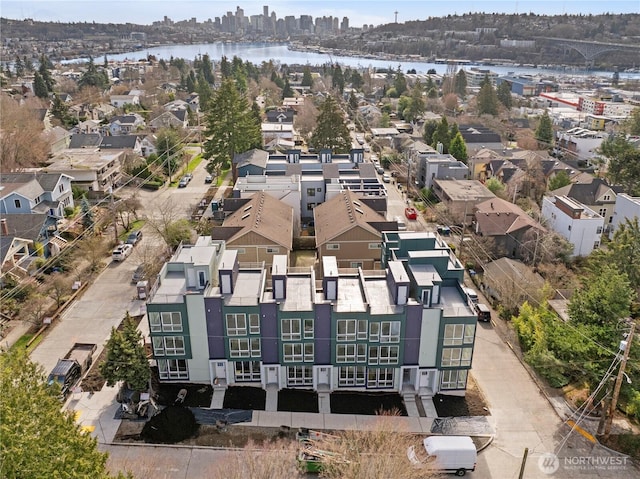 birds eye view of property with a water view