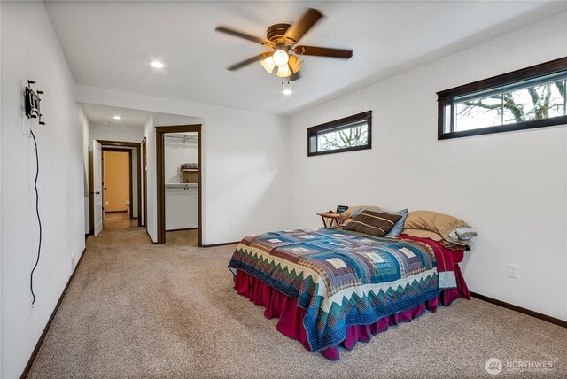 bedroom with baseboards, multiple windows, recessed lighting, and light colored carpet