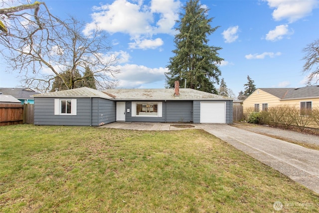 ranch-style home featuring an attached garage, fence, concrete driveway, a chimney, and a front yard