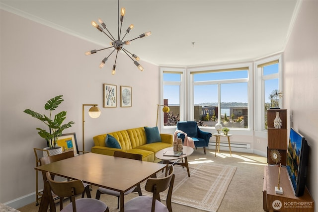 living area with baseboards, a baseboard radiator, crown molding, carpet floors, and a notable chandelier