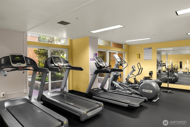 exercise room featuring visible vents