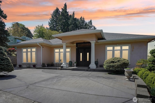 113 Northridge Dr, Ridgefield, WA 98642 - rear view of property featuring a porch, a shingled roof, and stucco siding