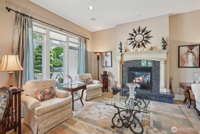 113 Northridge Dr, Ridgefield, WA 98642 - sitting room with recessed lighting, light tile patterned flooring, and a fireplace