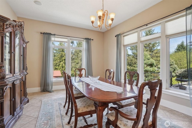 113 Northridge Dr, Ridgefield, WA 98642 - dining room featuring light tile patterned floors, an inviting chandelier, and a healthy amount of sunlight