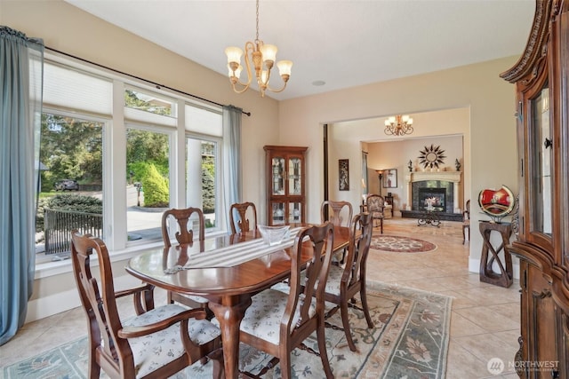 113 Northridge Dr, Ridgefield, WA 98642 - dining space featuring an inviting chandelier, light tile patterned floors, and a premium fireplace