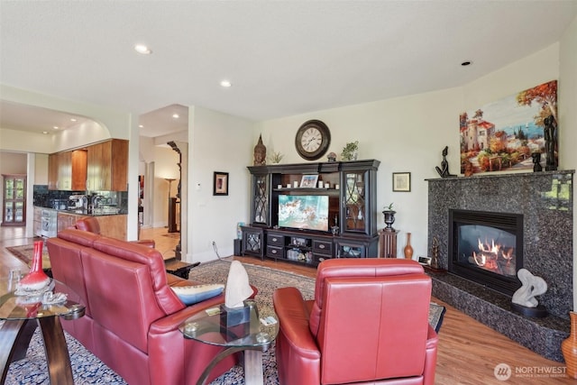 113 Northridge Dr, Ridgefield, WA 98642 - living room featuring baseboards, recessed lighting, wood finished floors, and a premium fireplace