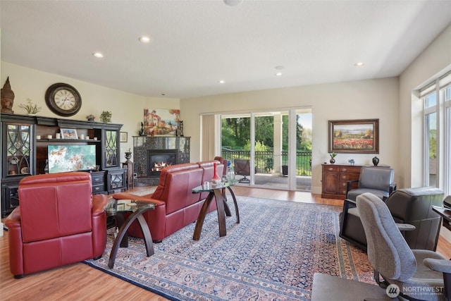 113 Northridge Dr, Ridgefield, WA 98642 - living room featuring a fireplace, recessed lighting, and wood finished floors