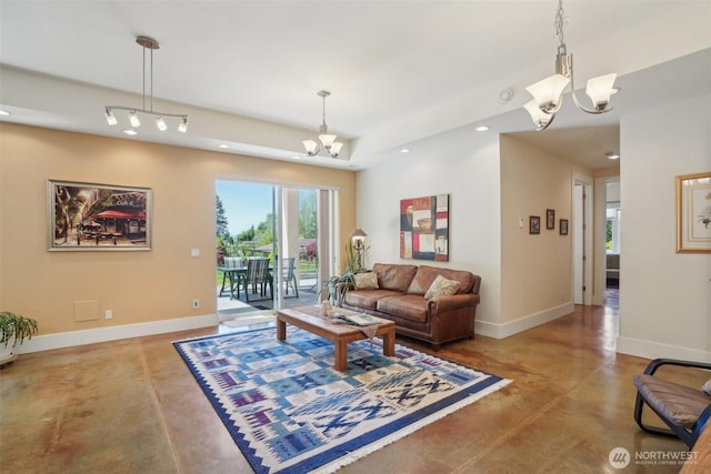 113 Northridge Dr, Ridgefield, WA 98642 - living room featuring baseboards, concrete floors, and a chandelier