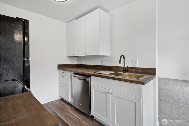 kitchen with dishwasher, butcher block countertops, and white cabinets