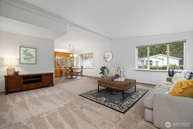 living room featuring a wealth of natural light, light carpet, vaulted ceiling with beams, and a notable chandelier