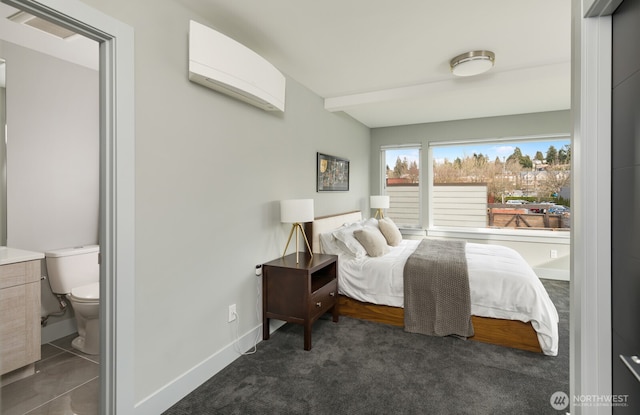 bedroom featuring a wall unit AC, visible vents, baseboards, beam ceiling, and dark colored carpet