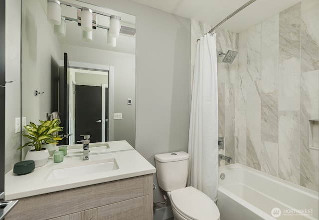 full bathroom with double vanity, a sink, toilet, and shower / bath combo with shower curtain