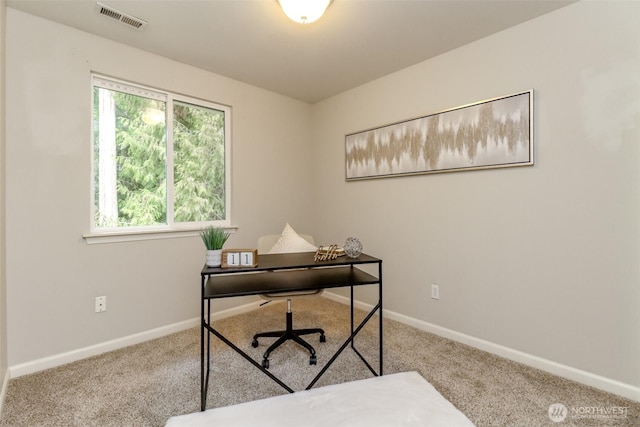 office featuring light carpet, baseboards, and visible vents