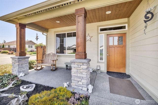 entrance to property featuring a porch