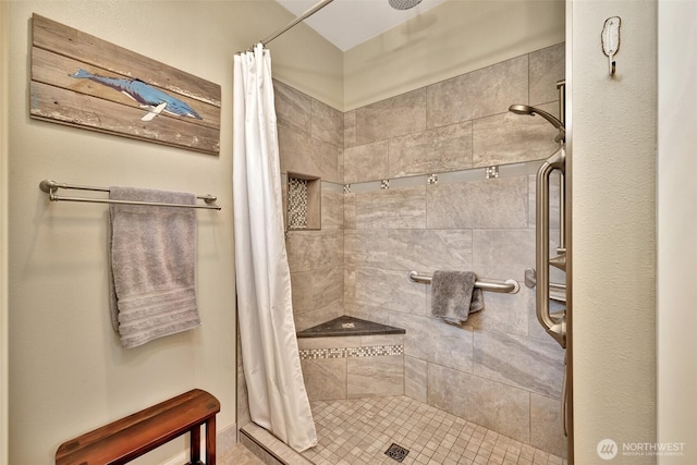 full bath featuring a shower stall