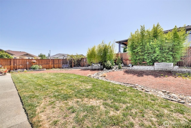 view of yard with a fenced backyard