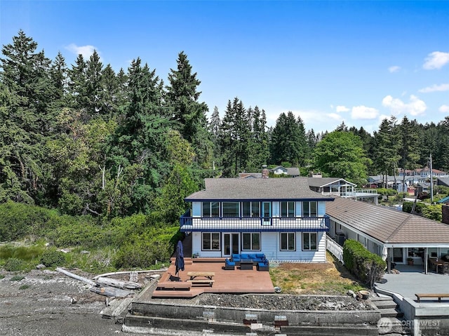 view of front of home featuring a wooden deck and a balcony