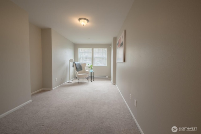 unfurnished room with baseboards, a baseboard heating unit, and light colored carpet