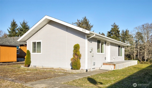 view of property exterior featuring crawl space and a yard