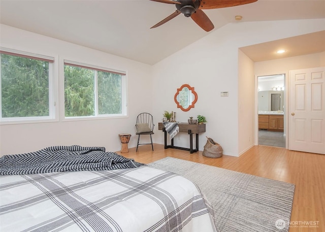 bedroom featuring light wood-style floors and vaulted ceiling