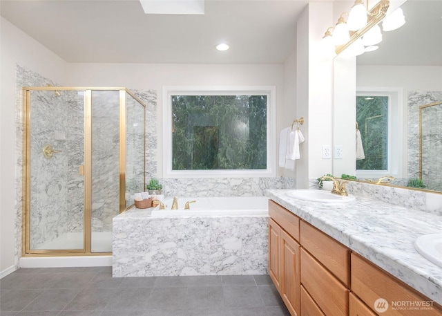 full bath with a garden tub, a sink, a shower stall, tile patterned floors, and double vanity