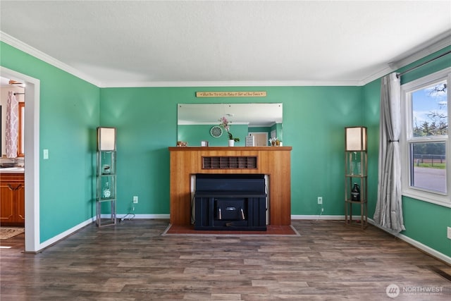 unfurnished living room with baseboards, a textured ceiling, dark wood finished floors, and crown molding