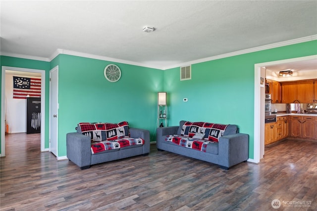 living room with ornamental molding, visible vents, dark wood finished floors, and baseboards