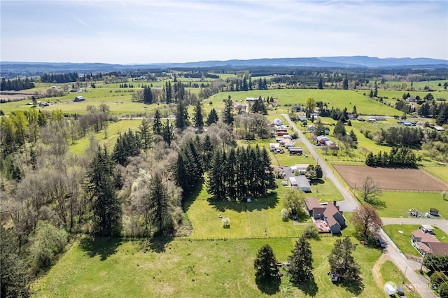 bird's eye view with a rural view and a mountain view