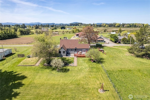 drone / aerial view featuring a mountain view and a rural view