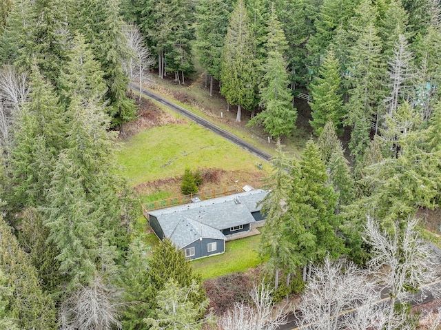 aerial view featuring a wooded view