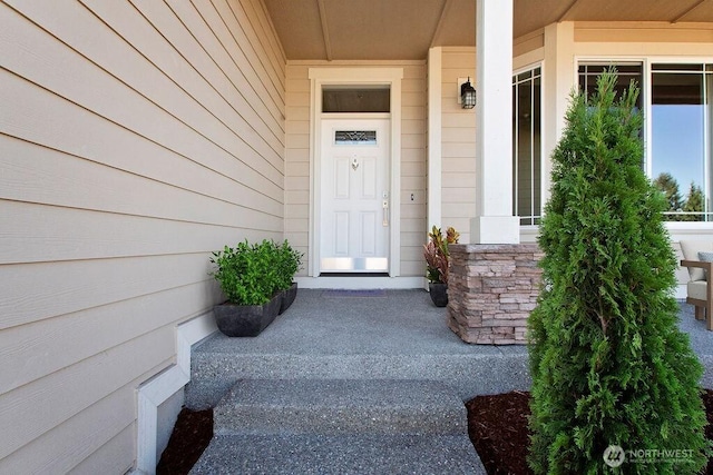 property entrance with stone siding