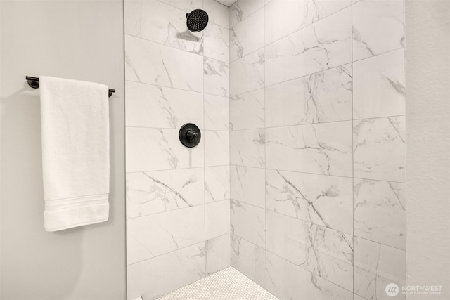 bathroom featuring a tile shower