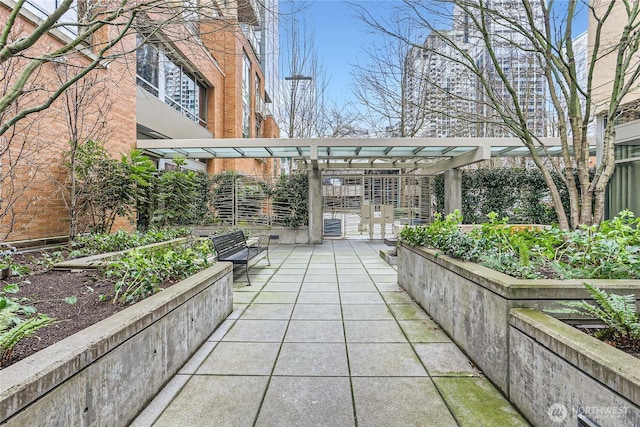 view of property's community with a vegetable garden