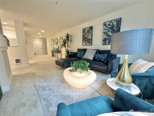 living area with baseboards, recessed lighting, and light colored carpet