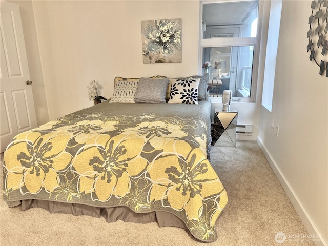 bedroom featuring carpet floors, a baseboard radiator, and baseboards