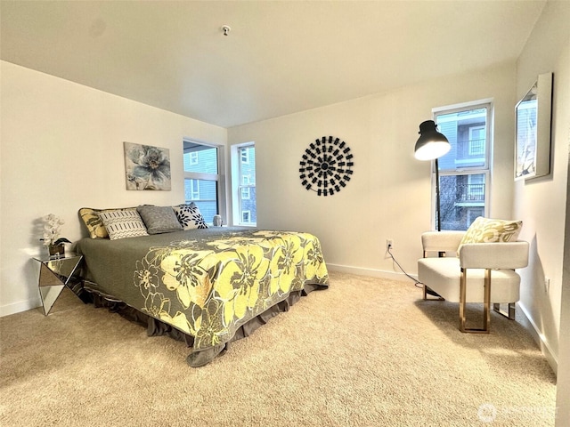 bedroom featuring carpet flooring and baseboards