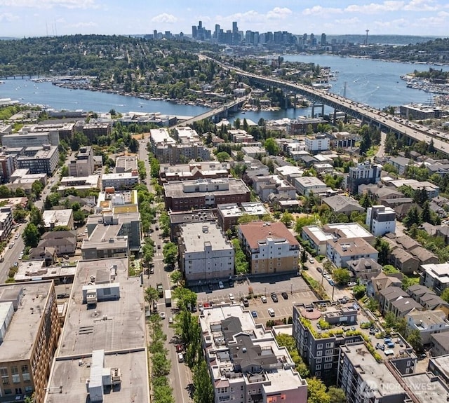 drone / aerial view with a view of city and a water view