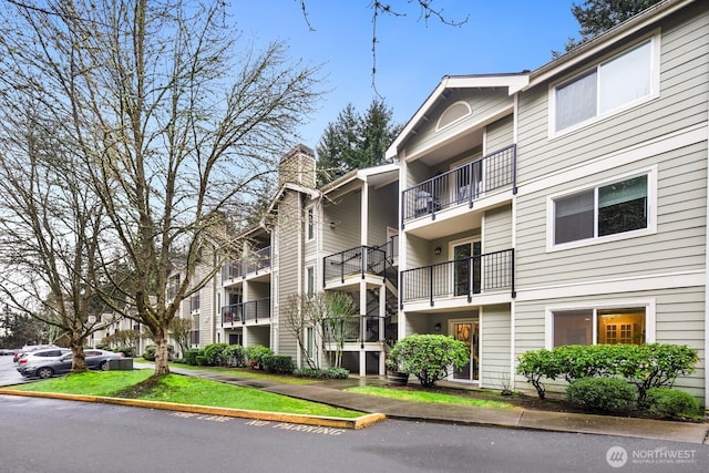 view of property with uncovered parking