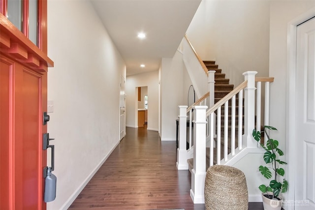 interior space with baseboards, dark wood-style flooring, stairs, and recessed lighting