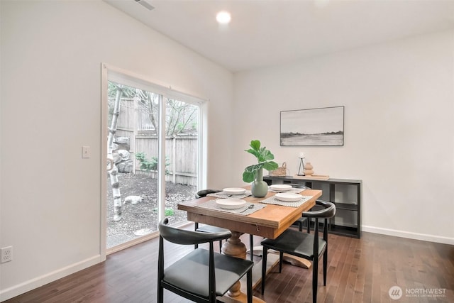 dining space with dark wood-style floors, baseboards, and recessed lighting