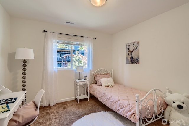 bedroom with carpet flooring, visible vents, and baseboards